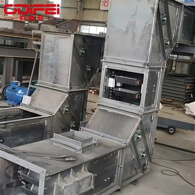 Alimentateur à godet basculant